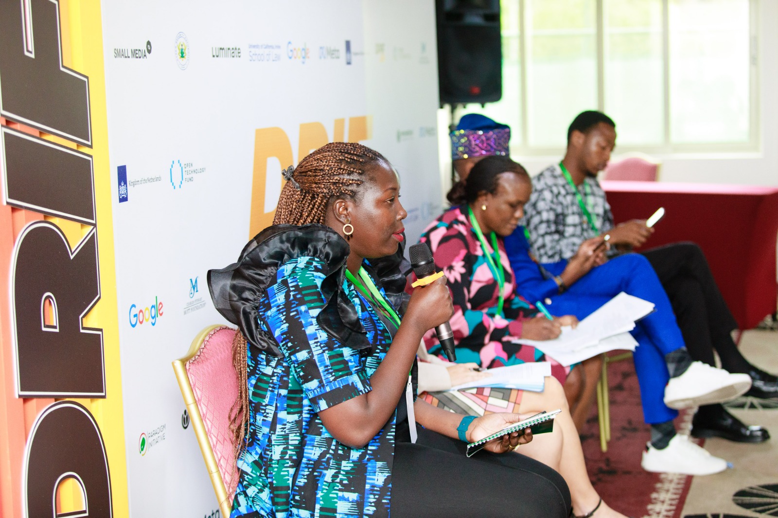 Three speakers talking during the event