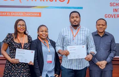 Peninah Susan Igaga and Audace Niyonkuru receive the Makane Faye AfriSIG Award. Photo: Courtesy of Hugo Domingo. image linking to Carrying Makane Faye’s legacy forward: AfriSIG 2025 honours two participants with award